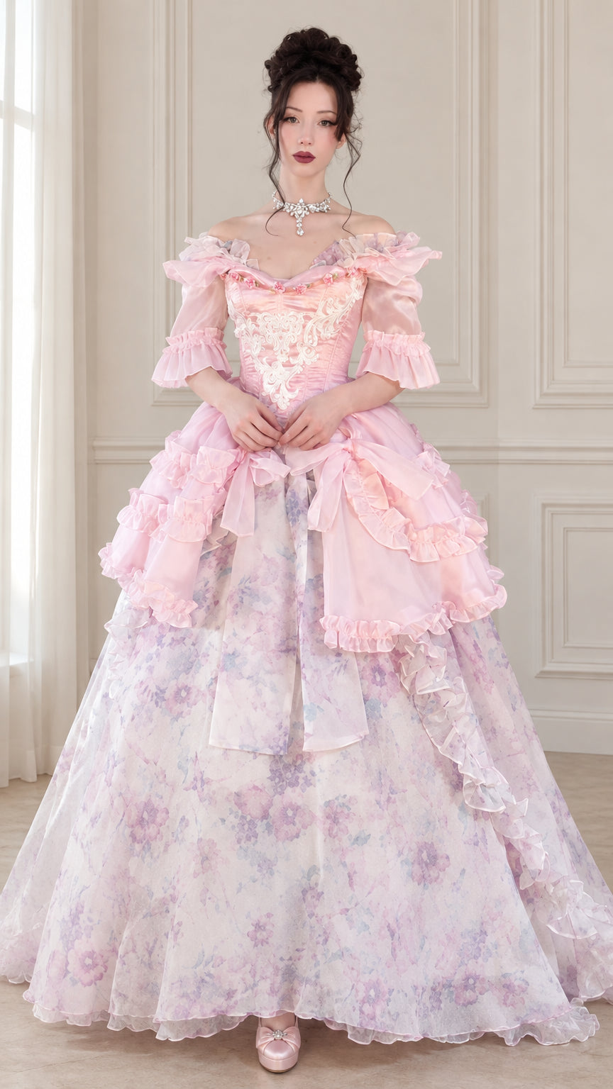 Front view of woman wearing pink Victorian Rococo corset ball gown with floral skirt and ruffles