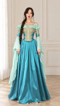 Front full view of woman wearing Teal Blue Renaissance corset gown with gold embroidery and long draped bell sleeves