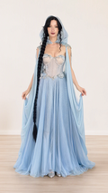 Front view of model wearing light blue hooded corset maxi gown with sweeping cape