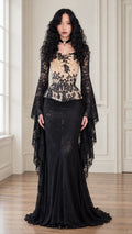Front full view of black Victorian gothic lace corset maxi dress with dramatic bell sleeves