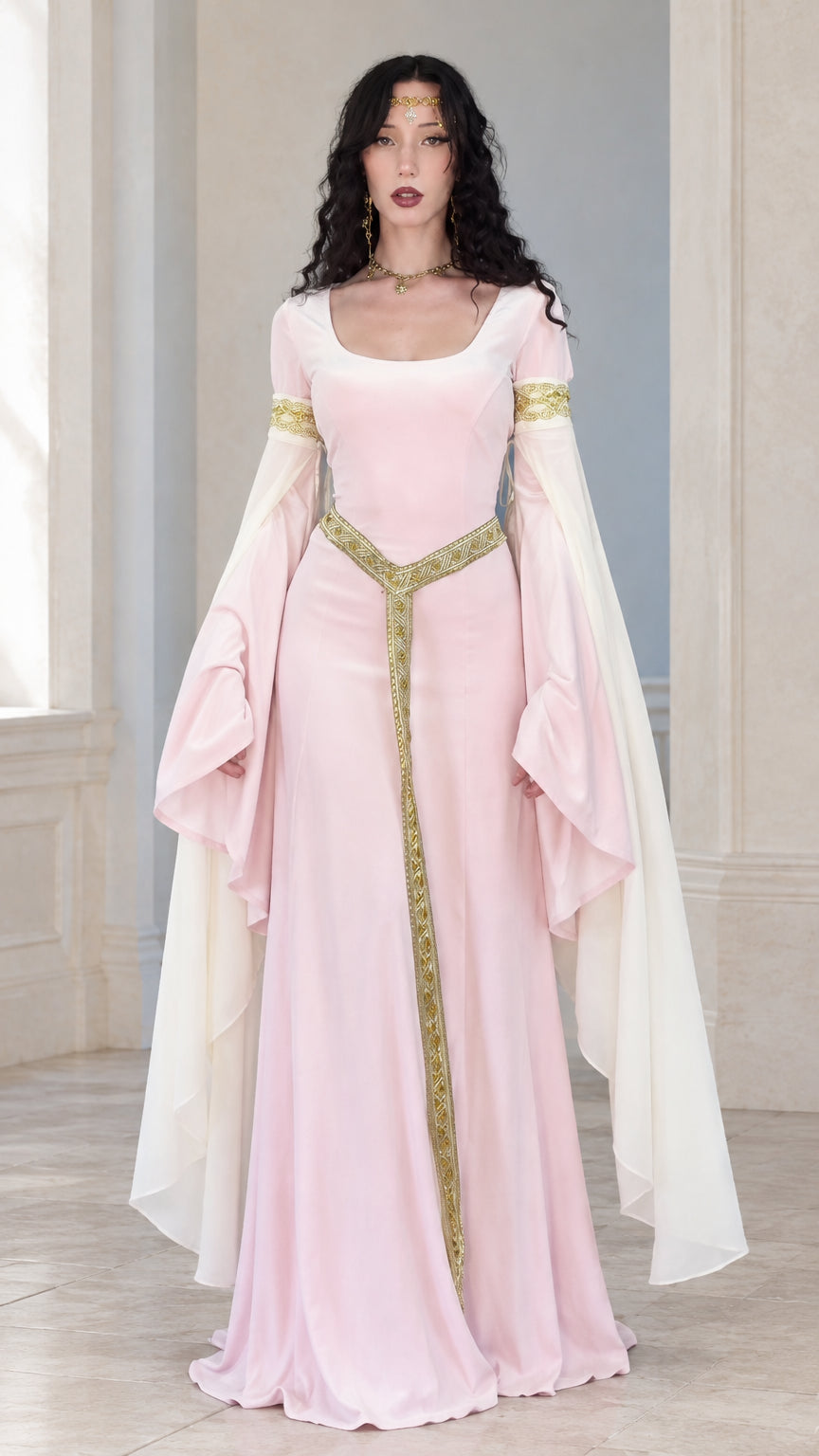 Full front view of woman wearing a light pink medieval renaissance maxi dress with gold trim and white draped bell sleeves