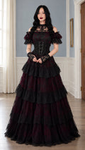 Front view of model wearing burgundy and black tiered gothic lace corset ball gown