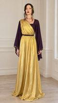 Front view of model wearing purple and gold Grecian draped maxi dress with bell sleeves