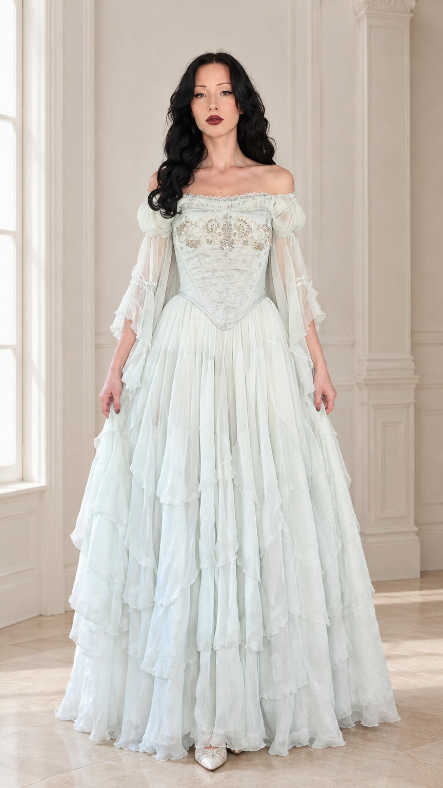 Full front view of the mint green off-shoulder embroidered corset ball gown with tiered ruffle skirt