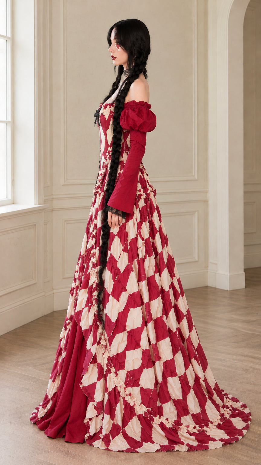 Side profile view of burgundy harlequin corset ball gown showcasing flowing train