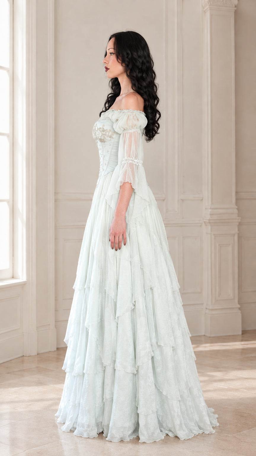 Side profile view of the mint green vintage corset ball gown highlighting the sweeping silhouette