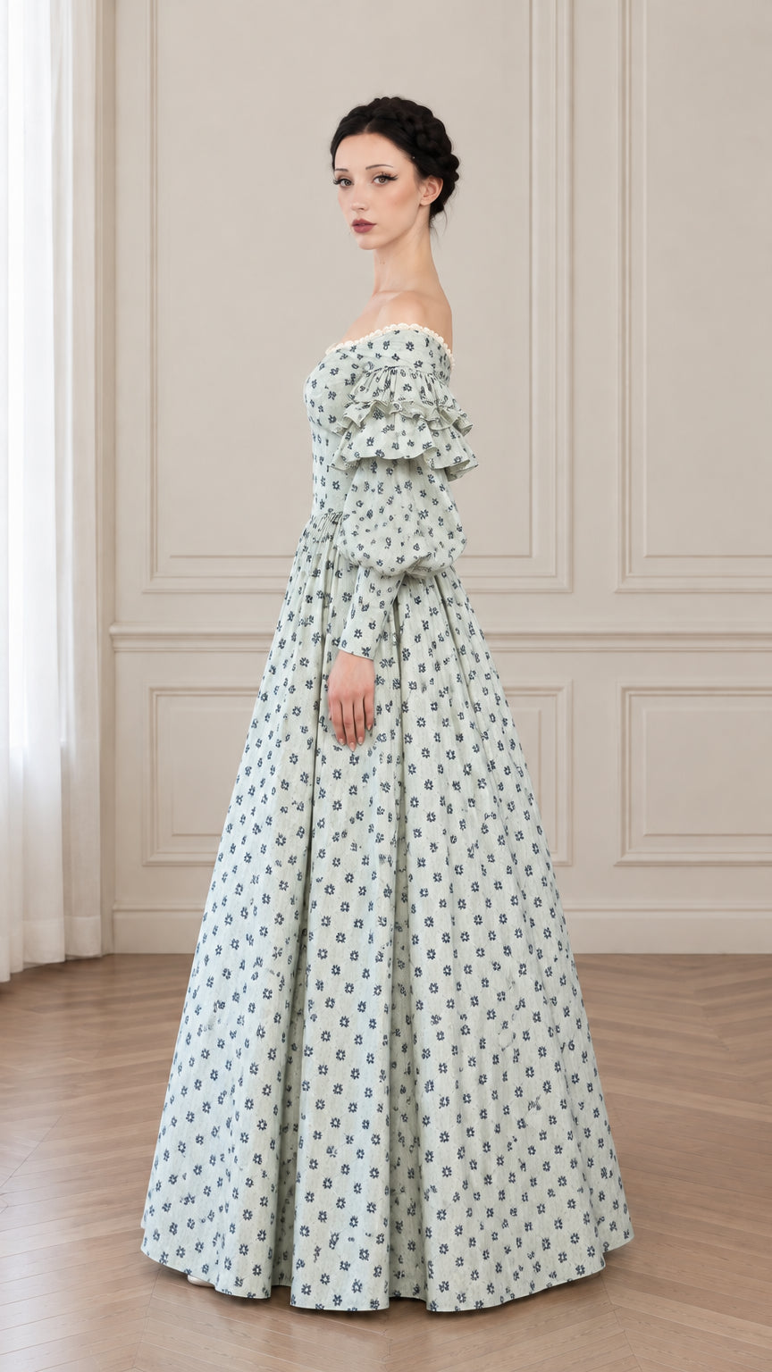 Side profile of woman in sage green floral Victorian style ball gown with gathered maxi skirt