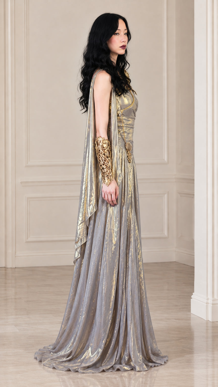 Silver grey metallic evening dress side view displaying fluid draped cape