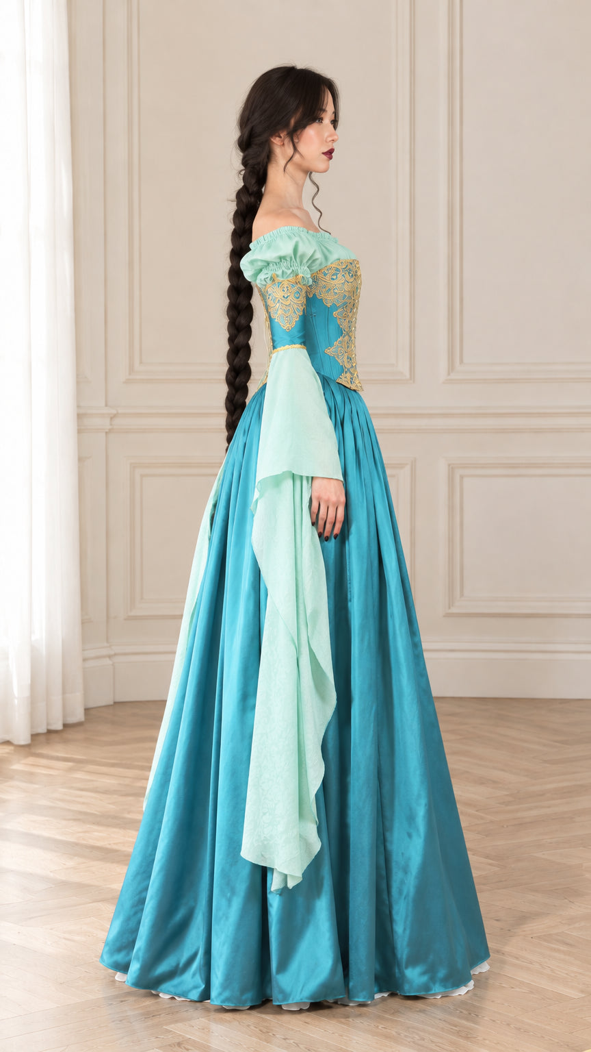 Side profile view of woman modeling Teal Blue Renaissance gown showing sleeve drape and skirt volume