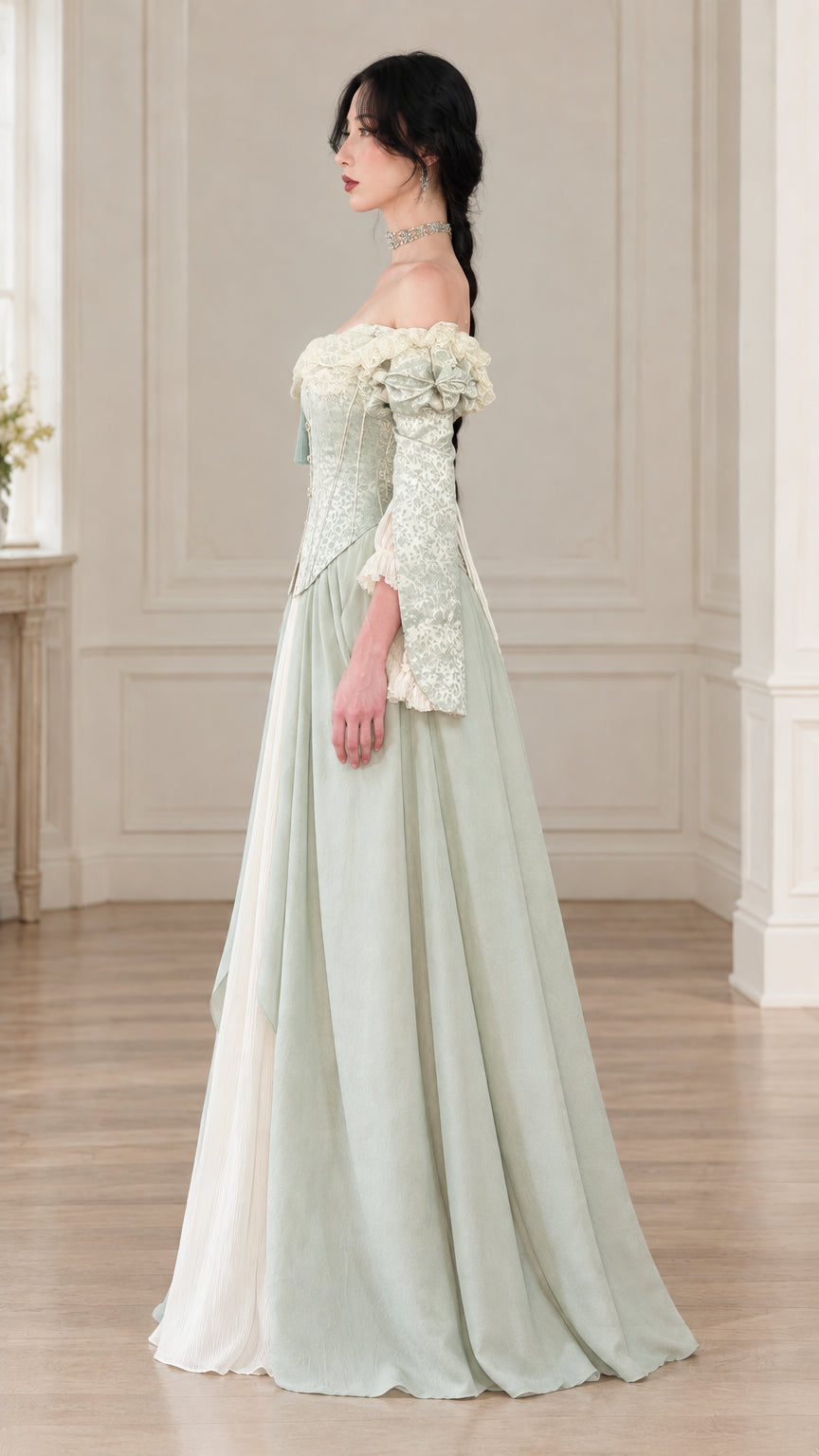 Side profile view of sage green Victorian corset ball gown with layered skirt