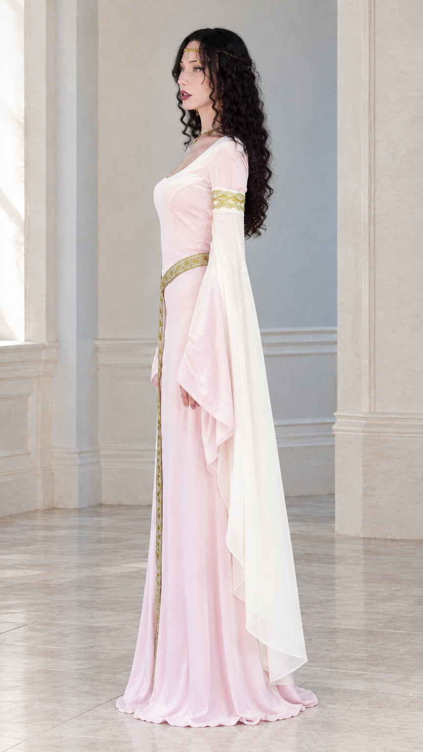 Side profile view of woman wearing a light pink renaissance gown with flowing flared sleeves