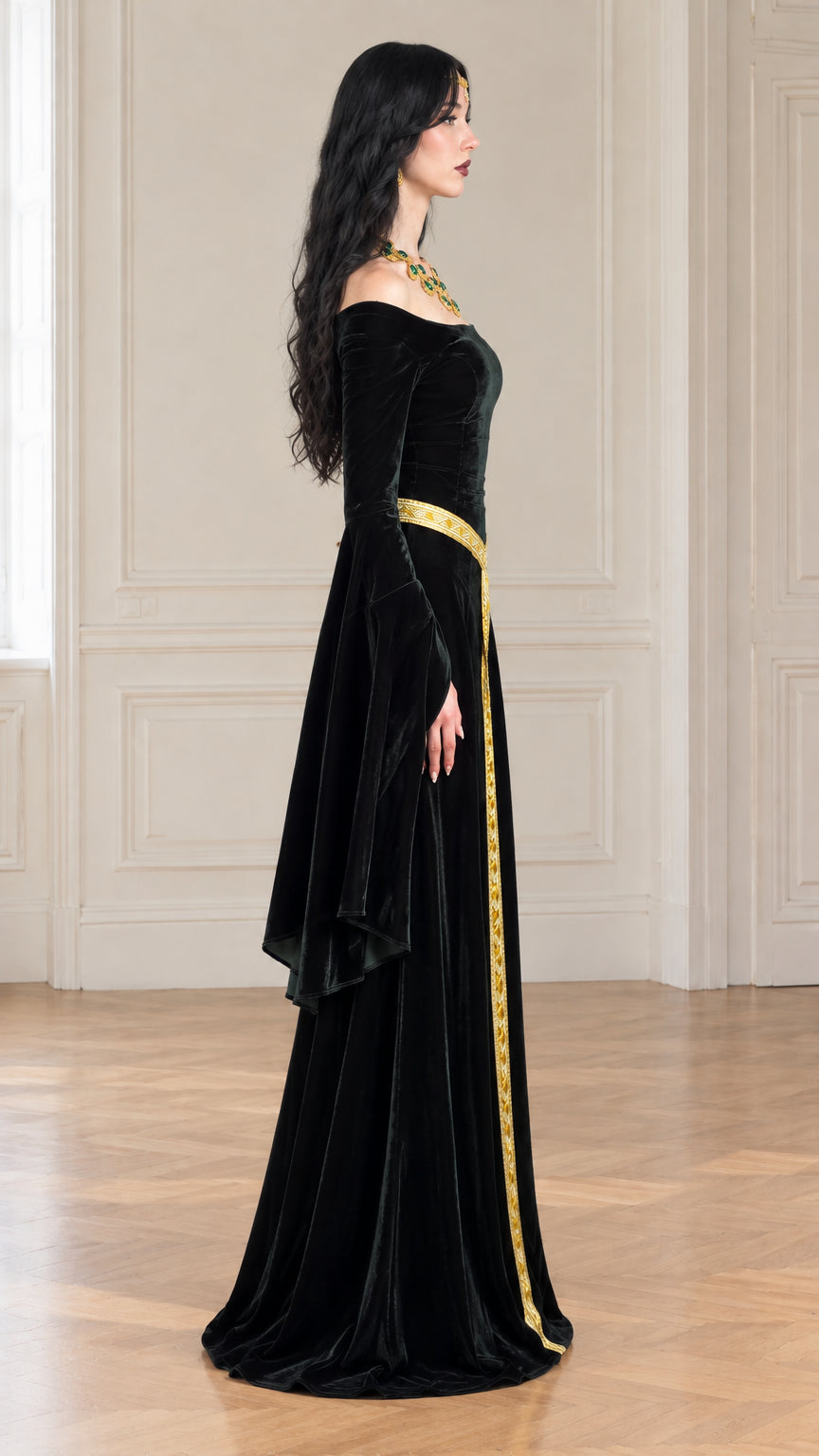 Side profile view of black velvet medieval gown showing flowing floor-length drape and elongated sleeves