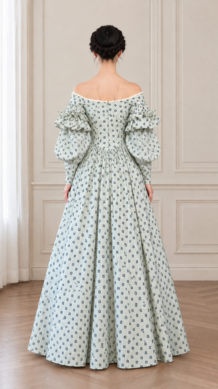 Back view of woman wearing sage green floral ball gown showing fitted back bodice and full skirt