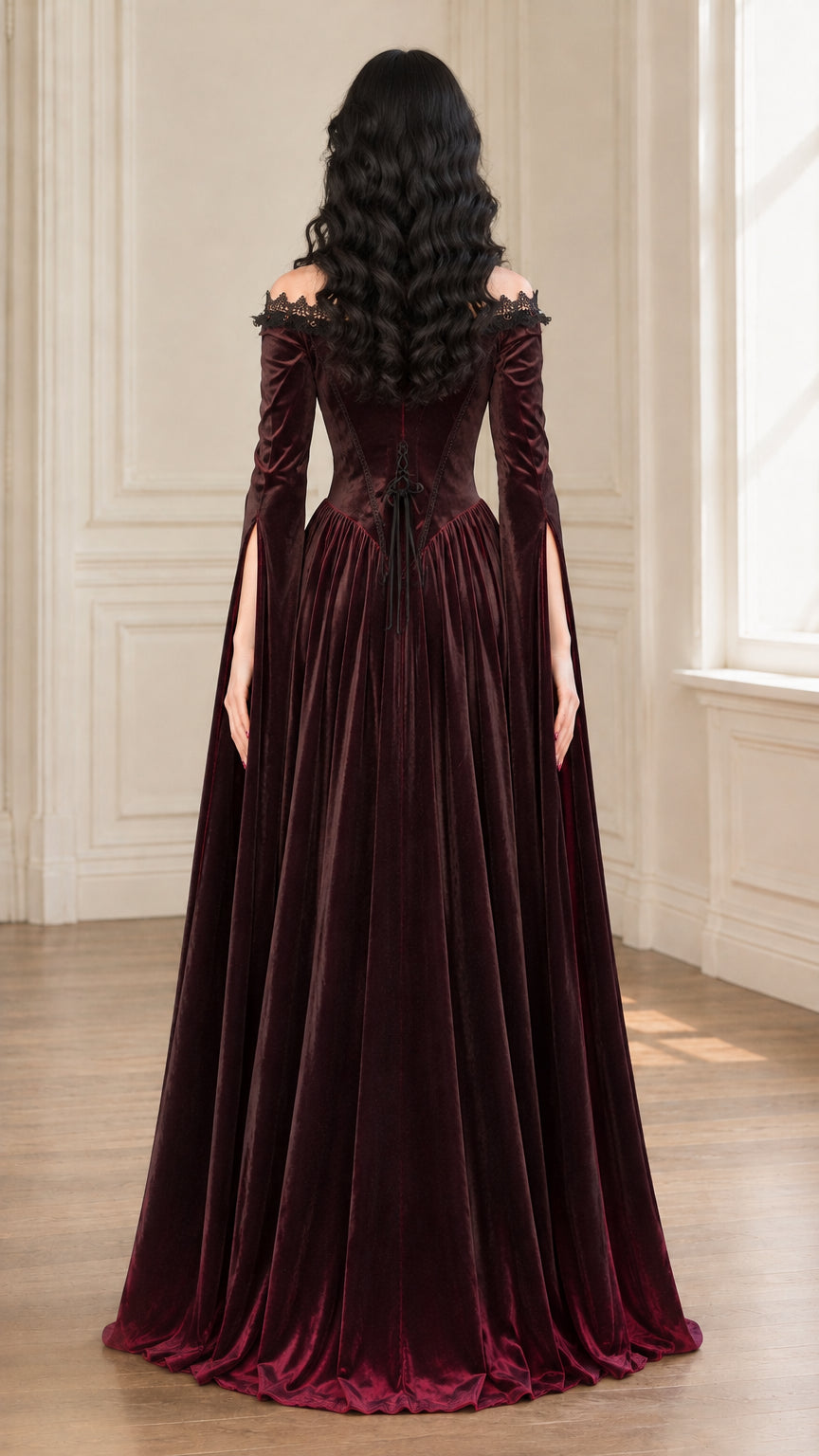 Back view of burgundy velvet gown showcasing lace-up detailing and full skirt