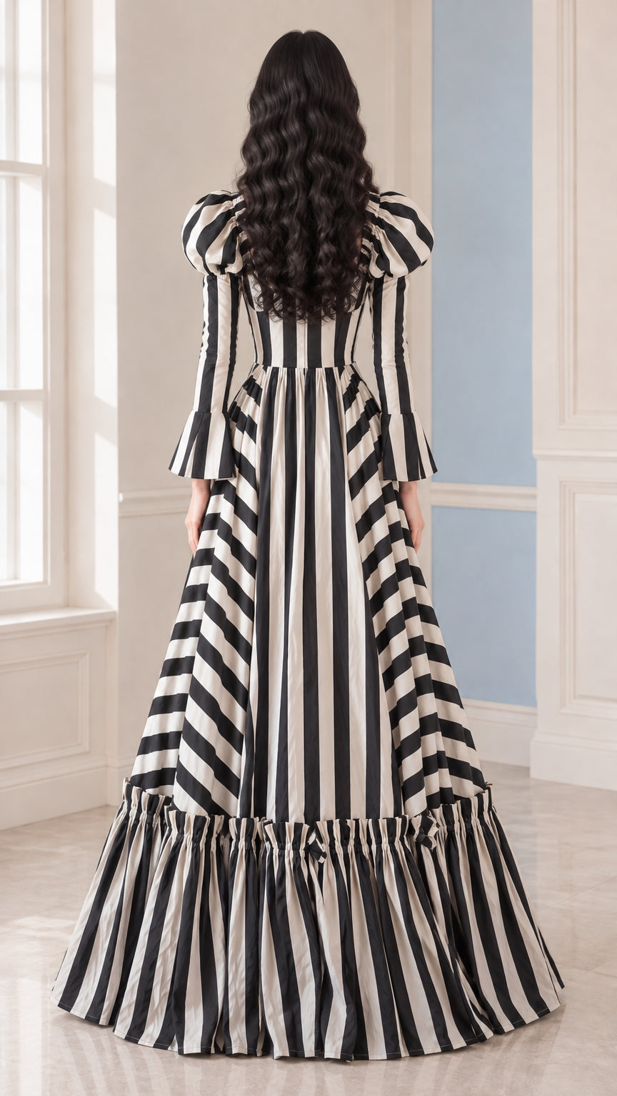 Back view of woman wearing the Black and White striped floor-length evening gown