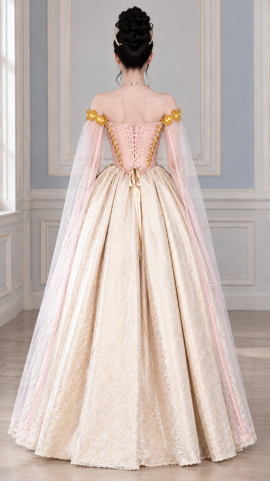 Back view of royal ball gown highlighting lace-up corset and sweeping cape sleeves