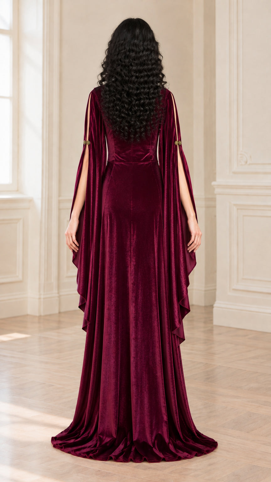 Back full-length view of burgundy velvet dress with flowing drape