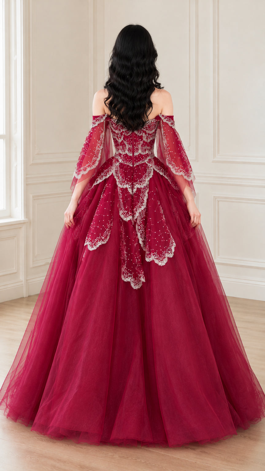 Back view of woman wearing burgundy off-the-shoulder beaded tulle evening gown