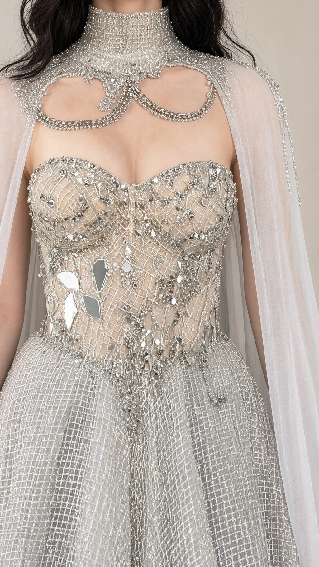 Close-up detail of silver sweetheart corset bodice featuring intricate beading, crystal embellishments, and illusion neckline