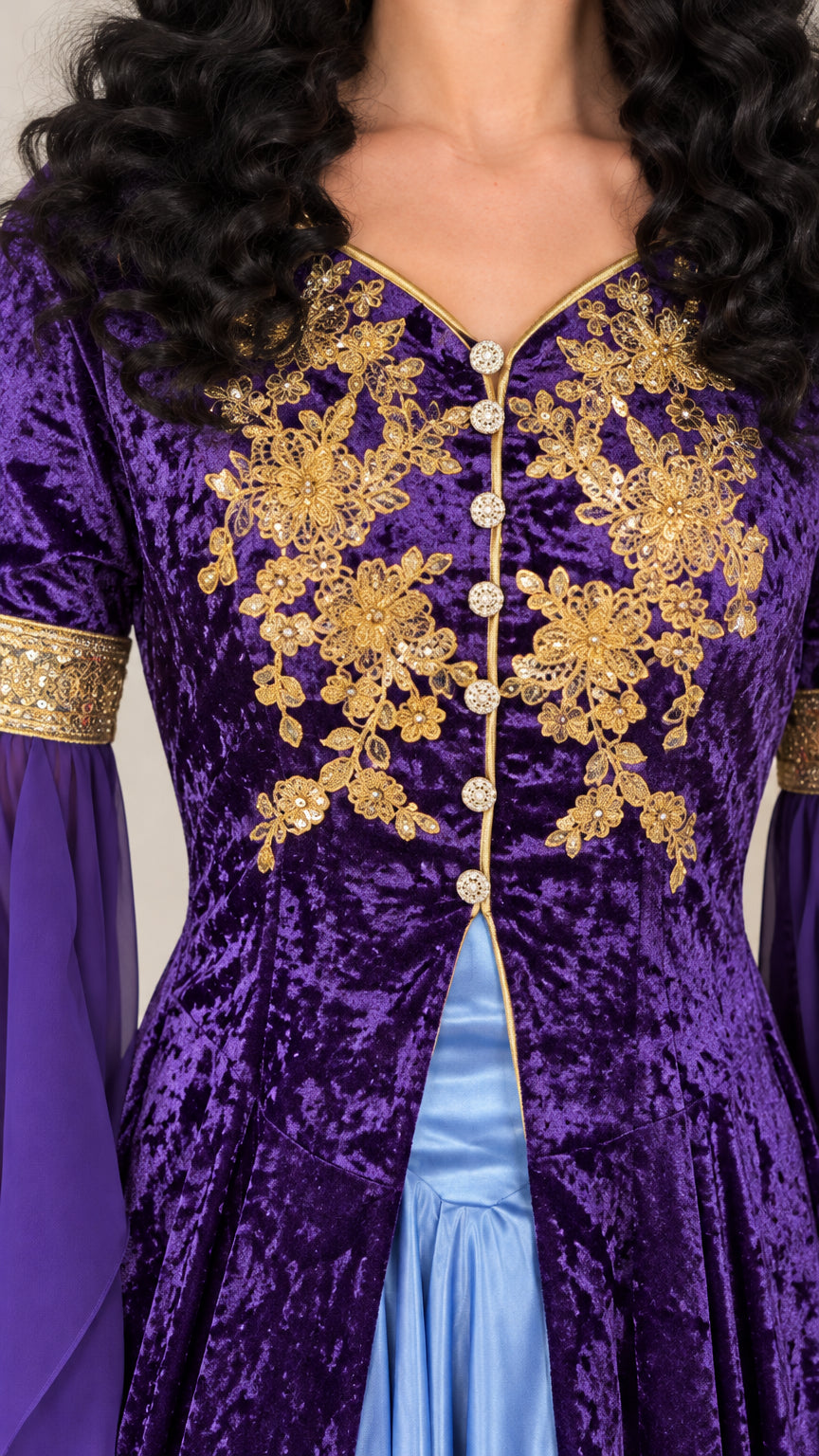 Close-up detail of ornate gold floral embroidery and decorative button closures on purple velvet bodice
