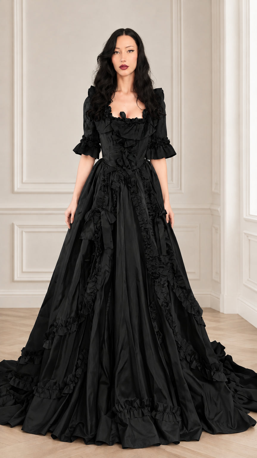 Woman wearing a black Victorian ruffled square neck maxi ball gown dress