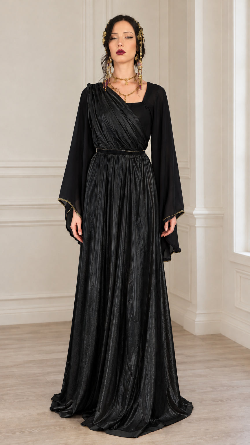 Front view of model wearing all-black draped maxi dress with bell sleeves