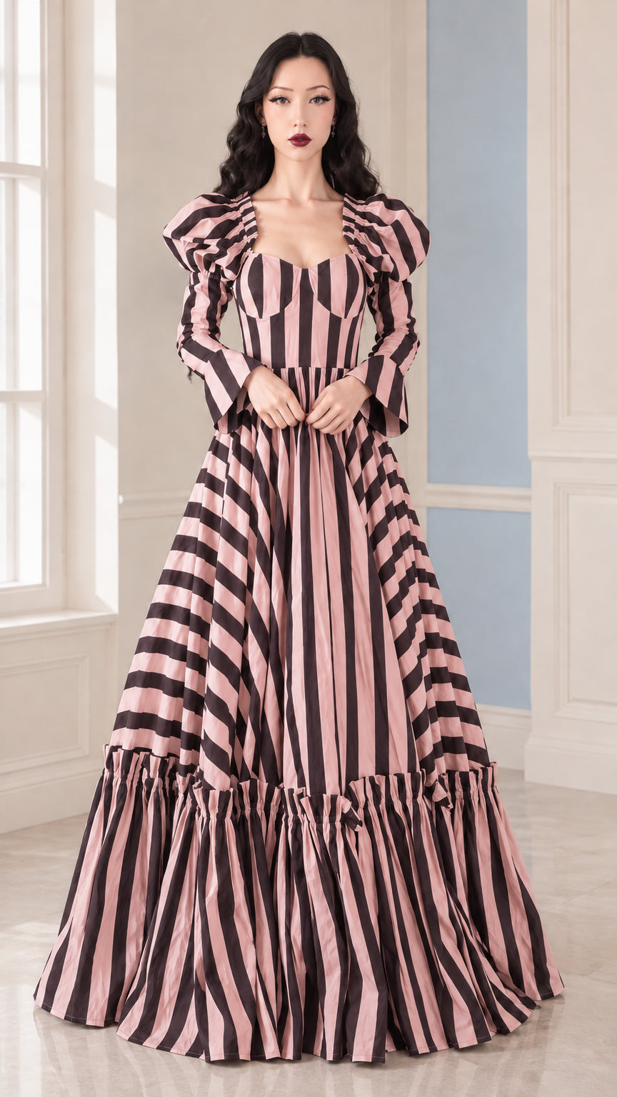 Front view of woman wearing Pink and Black striped sweetheart tiered maxi gown