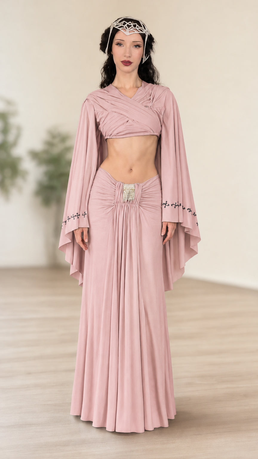 Front view of model wearing dusty pink fantasy wrap crop top and ruched maxi skirt set