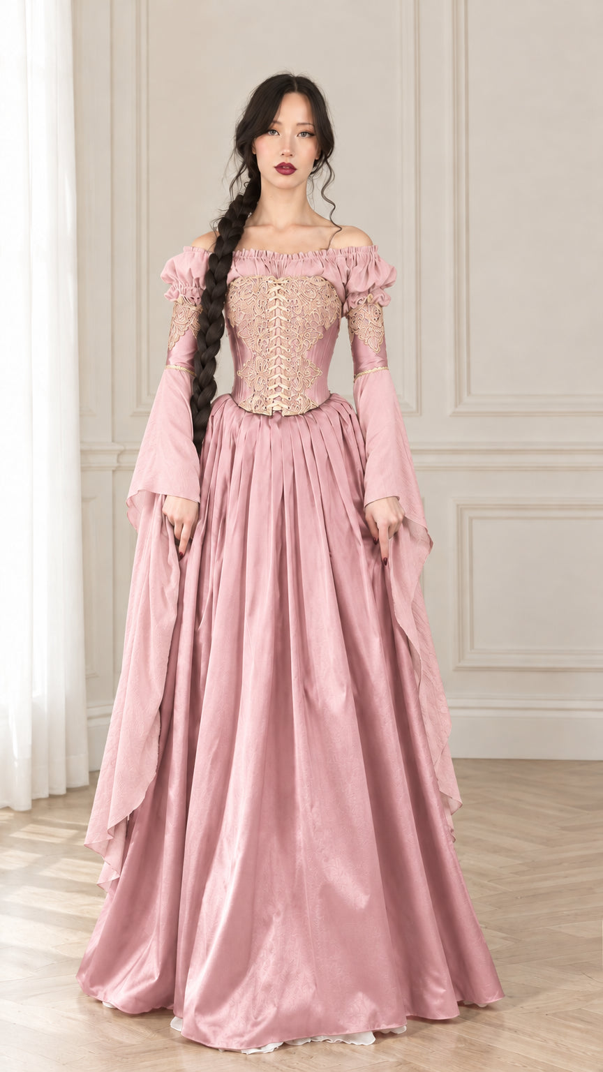 Front view of woman wearing Dusty Pink Renaissance corset gown with gold embroidery and draped sleeves