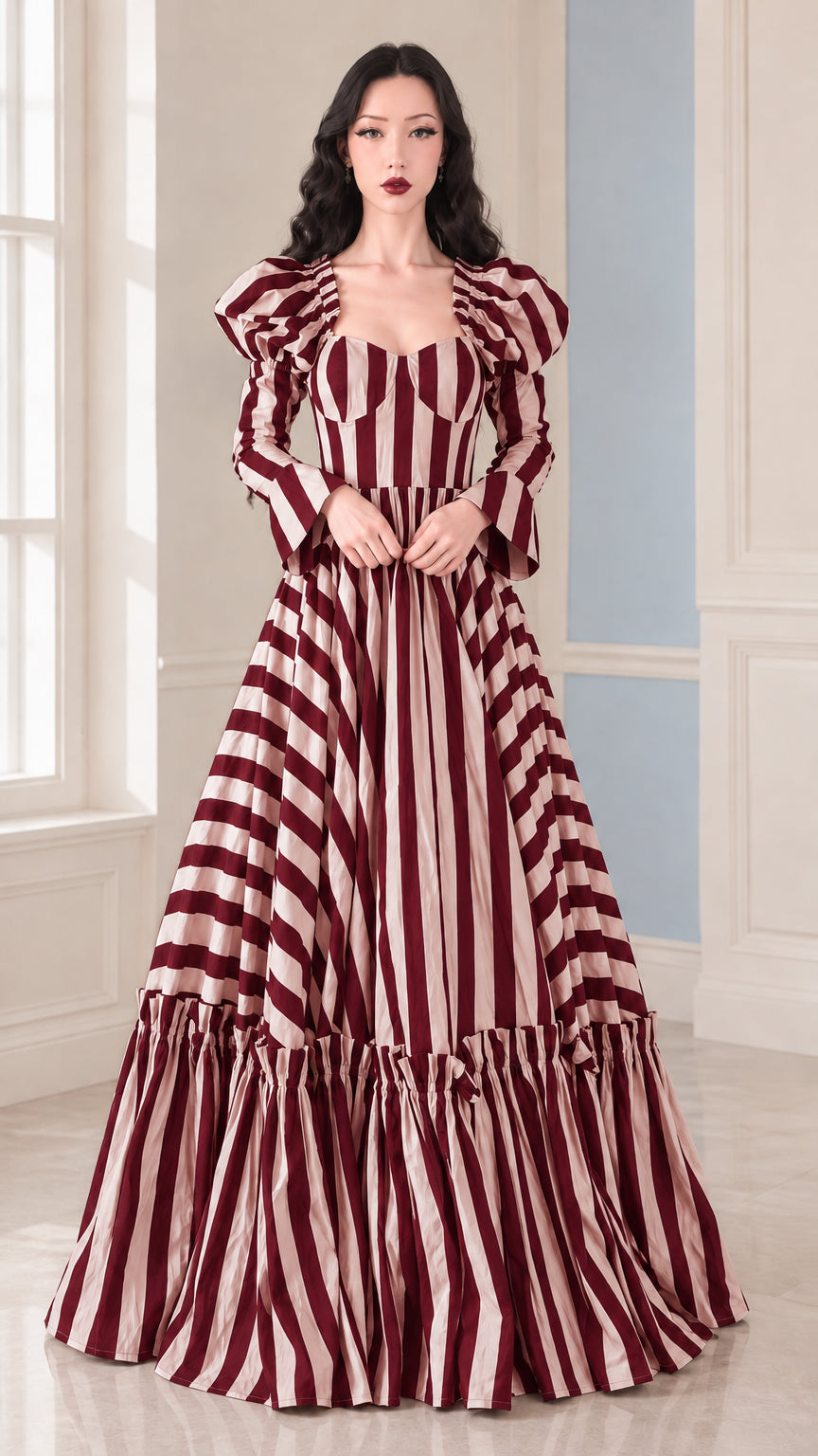 Front view of woman wearing Burgundy and White striped sweetheart tiered maxi gown