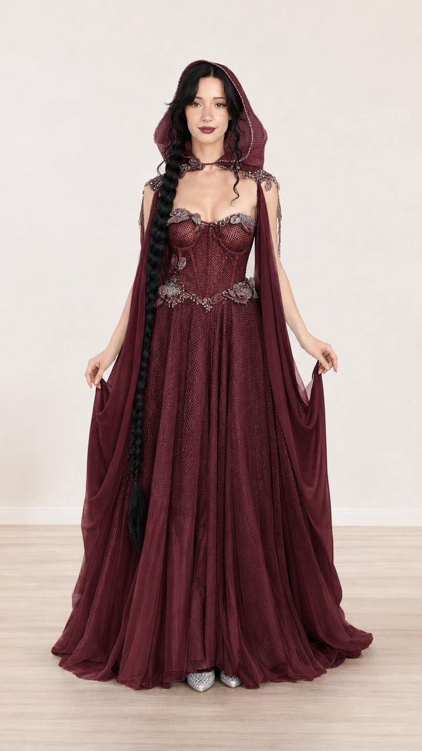 Full-length view of burgundy hooded formal maxi dress featuring structured bodice