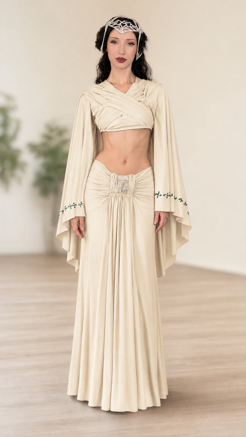 Front view of model wearing cream fantasy wrap crop top and ruched maxi skirt set